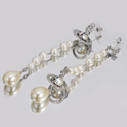 Broken pearl earrings (with box)