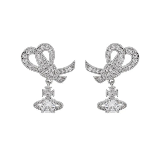 Bow & Four‑Prong Saturn Diamond Drop Earrings