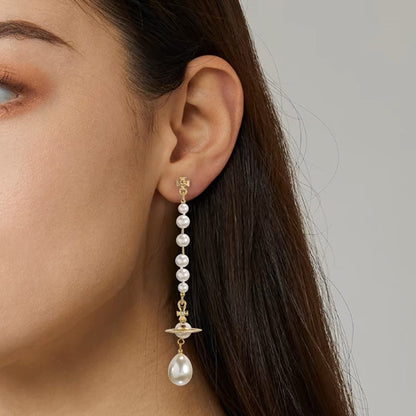 Broken pearl earrings (with box)