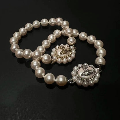 Ornate Pearl Emblem Bracelet
