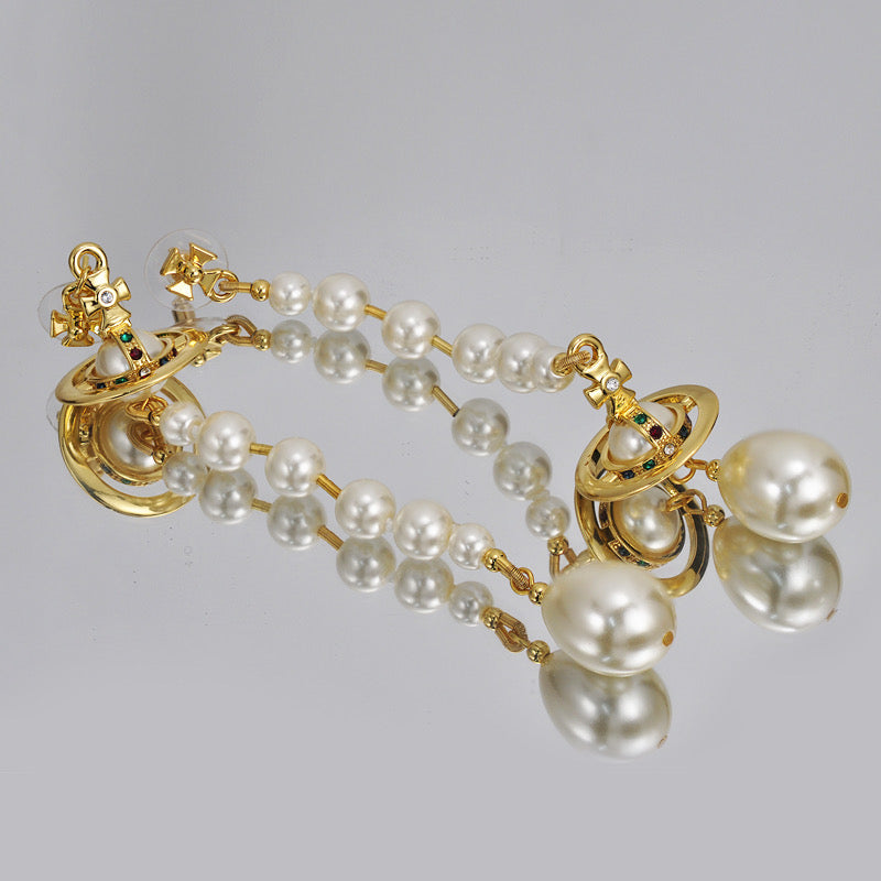 Broken pearl earrings (with box)