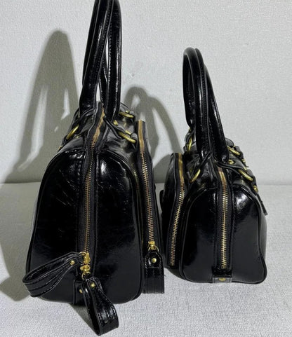 Structured Leather Boston Bag with Saturn Emblem